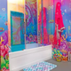 Image for article titled Would You Live in the Rainbow Explosion That Is the Hotels.com Lisa Frank SponCon Flat?
